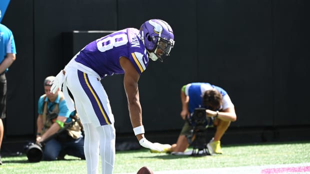 Oct 1, 2023; Charlotte, North Carolina, USA; Minnesota Vikings wide receiver Justin Jefferson (18) reacts after scoring a touchdown in the third quarter at Bank of America Stadium. Mandatory Credit: Bob Donnan-USA TODAY Sports  